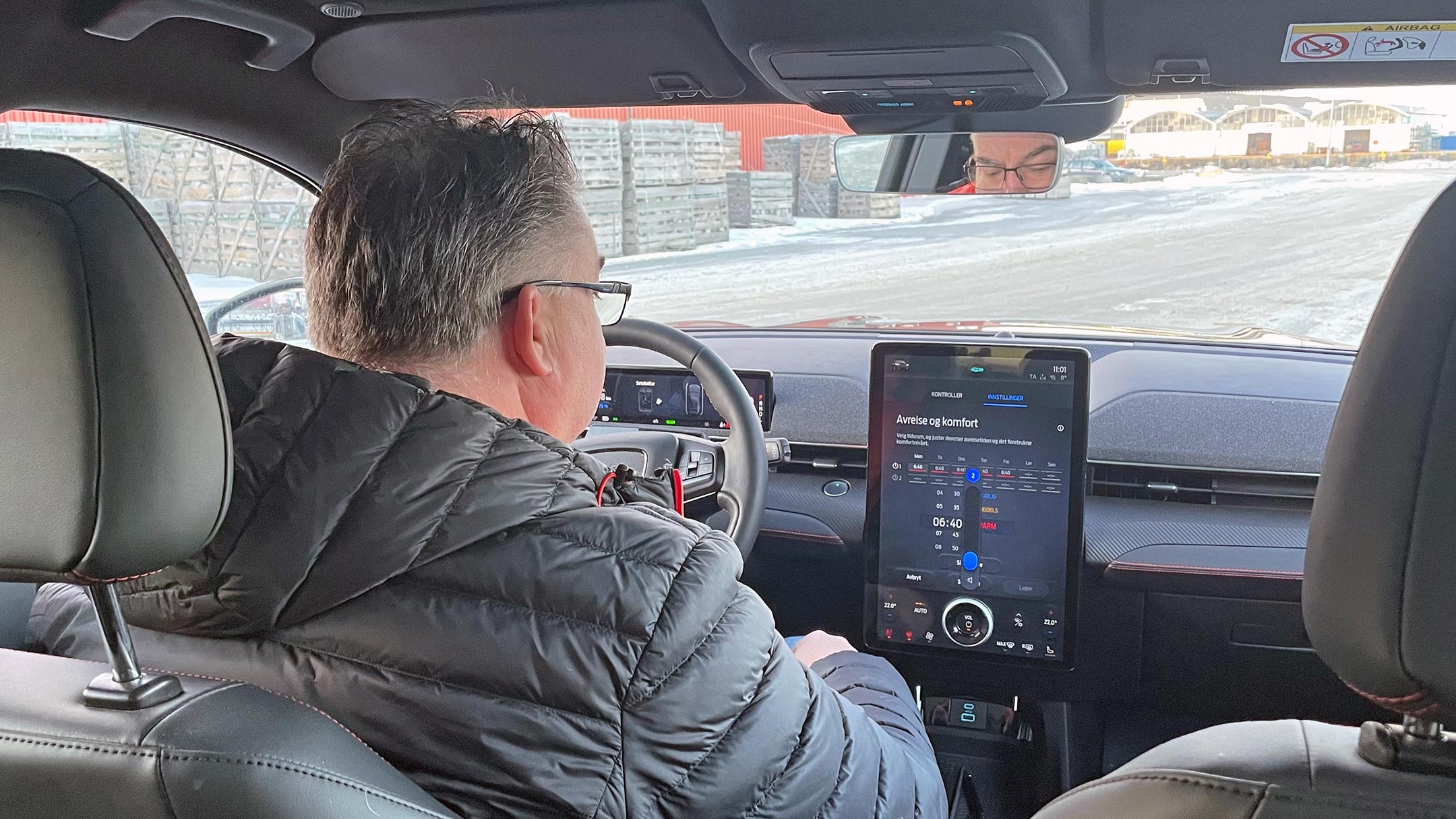 Man sitting in car