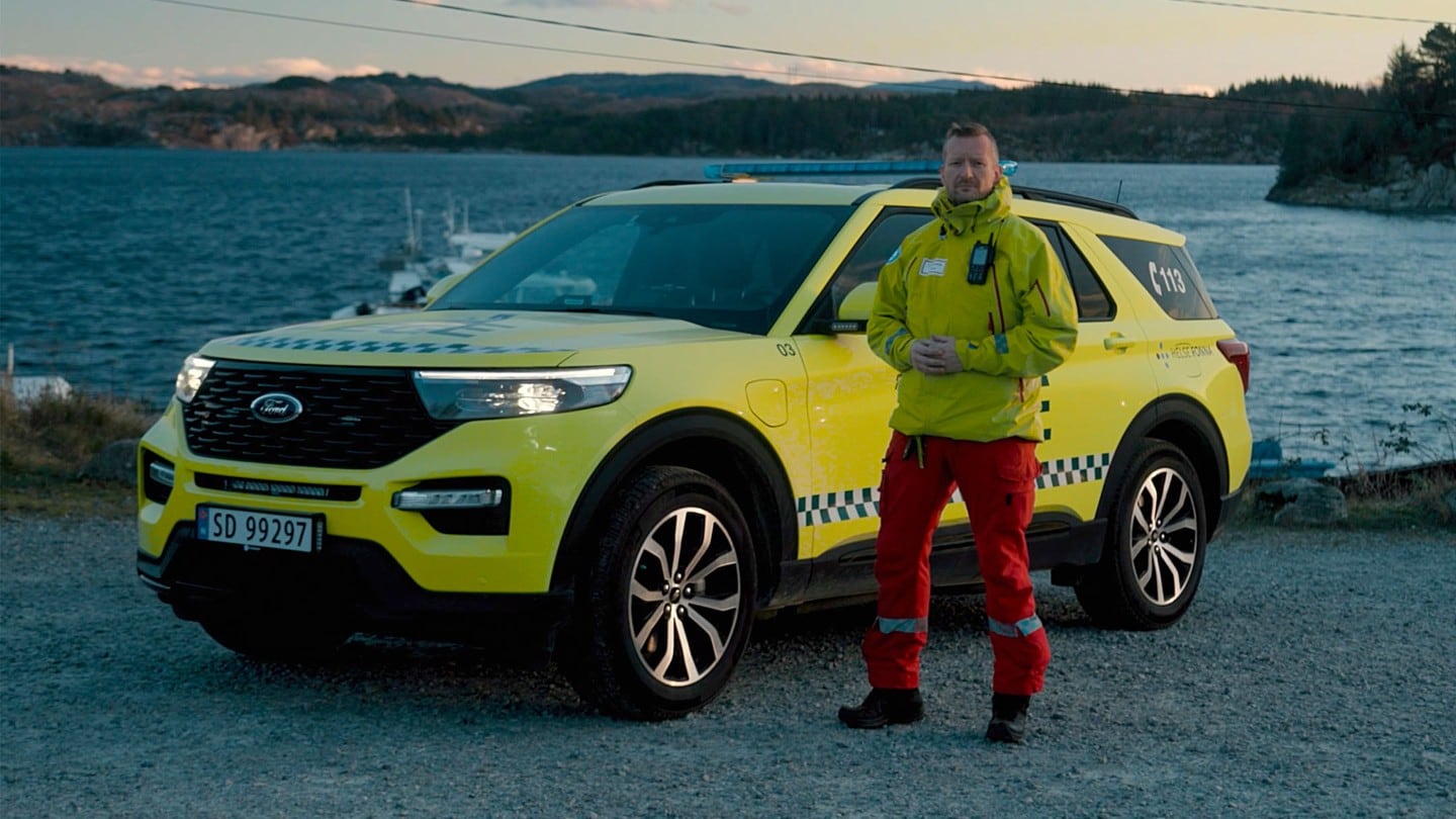Paramedic standing next to Ford Explorer