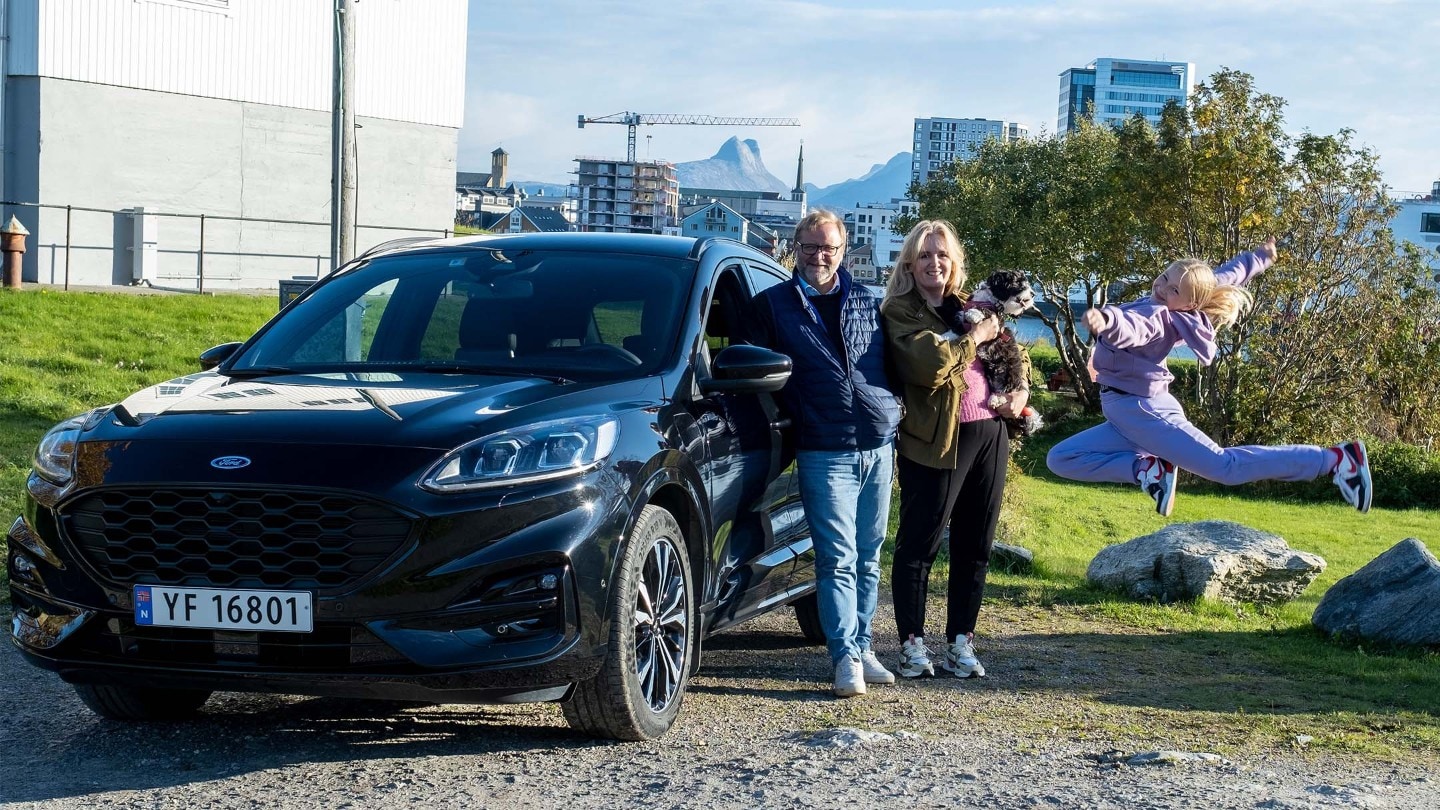 Family next to the car