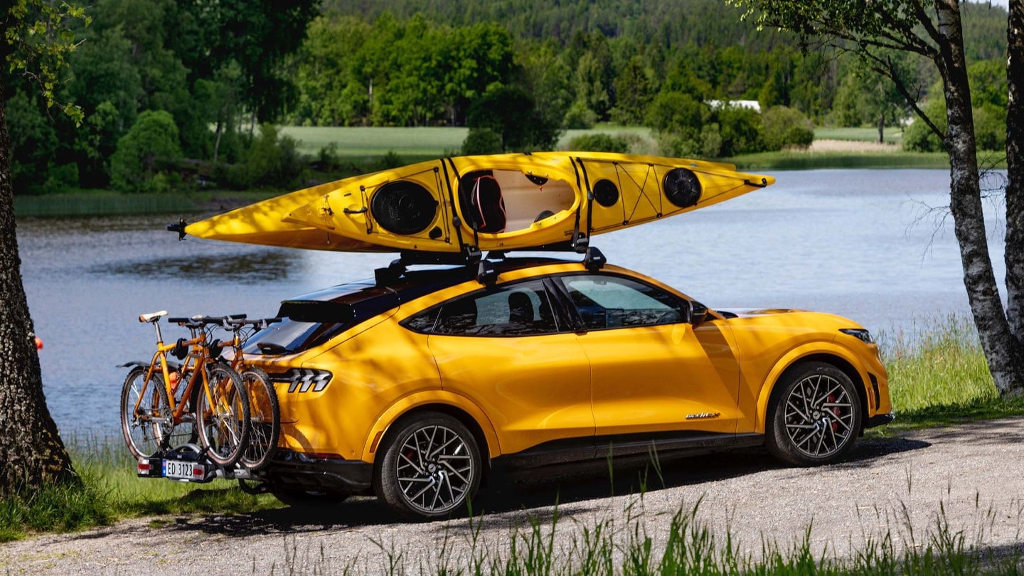 Yellow Mustang Mach-e with canoe