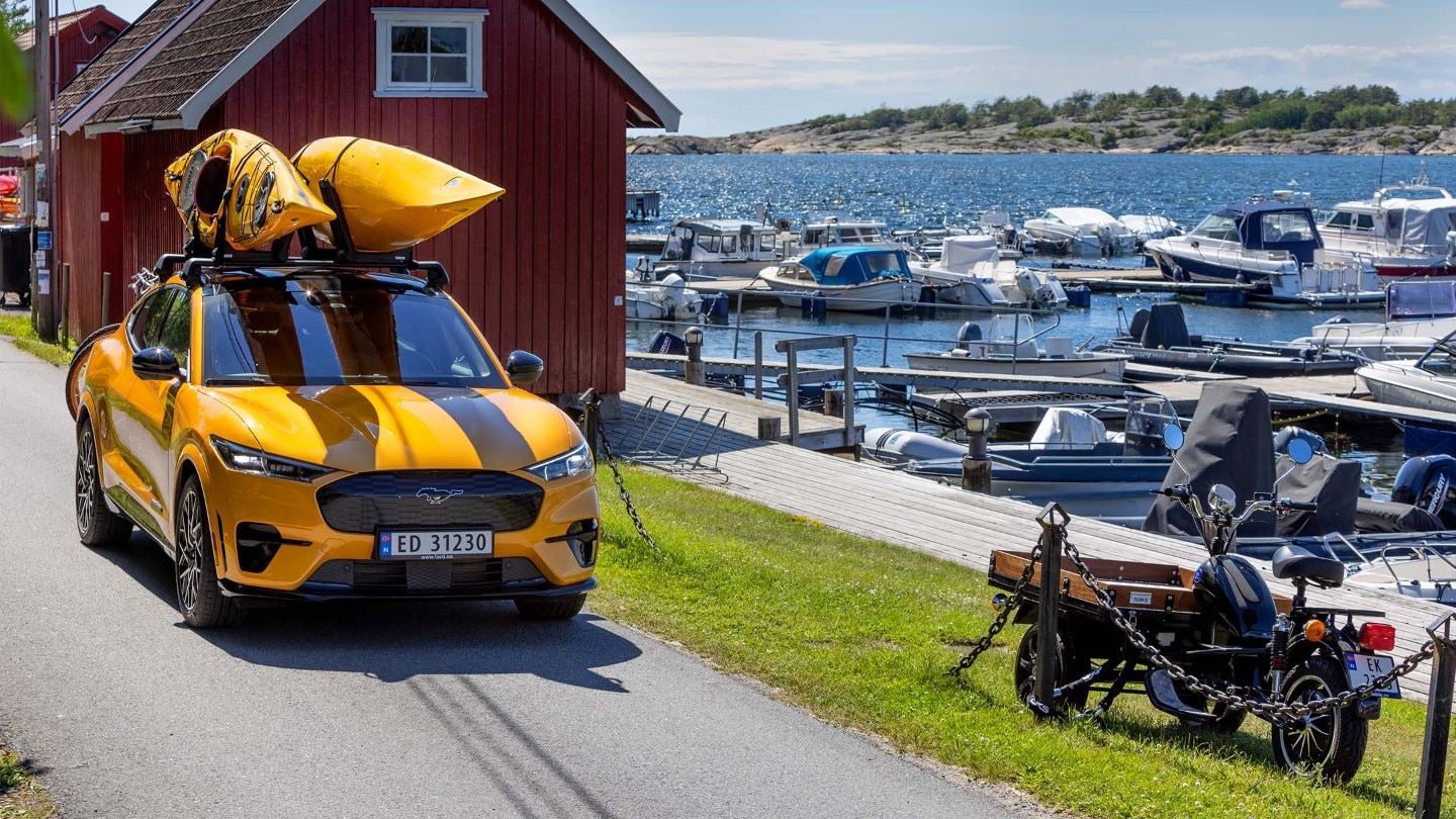 Yellow Mustang Mach-E with canoe