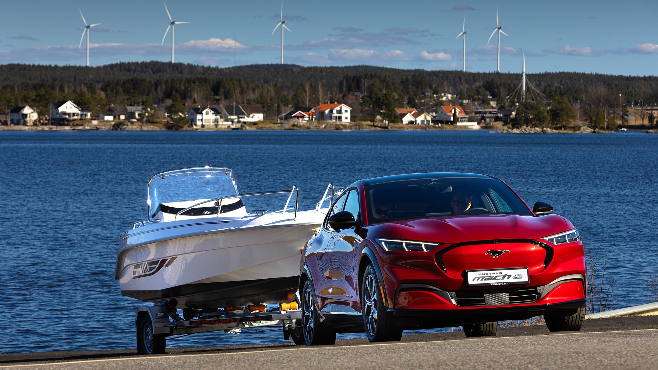 Mustang Mach-E towing a yacht