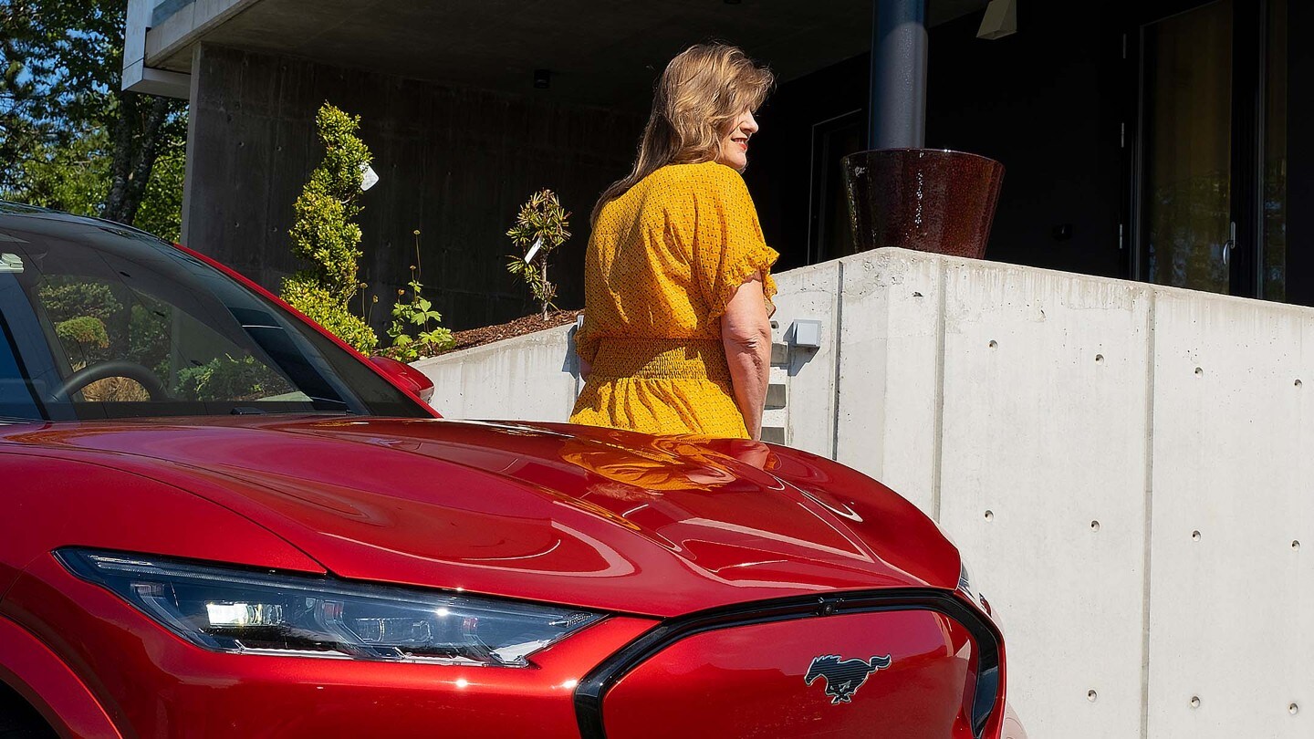 Lady in yellow dress and Mustang Mach-E