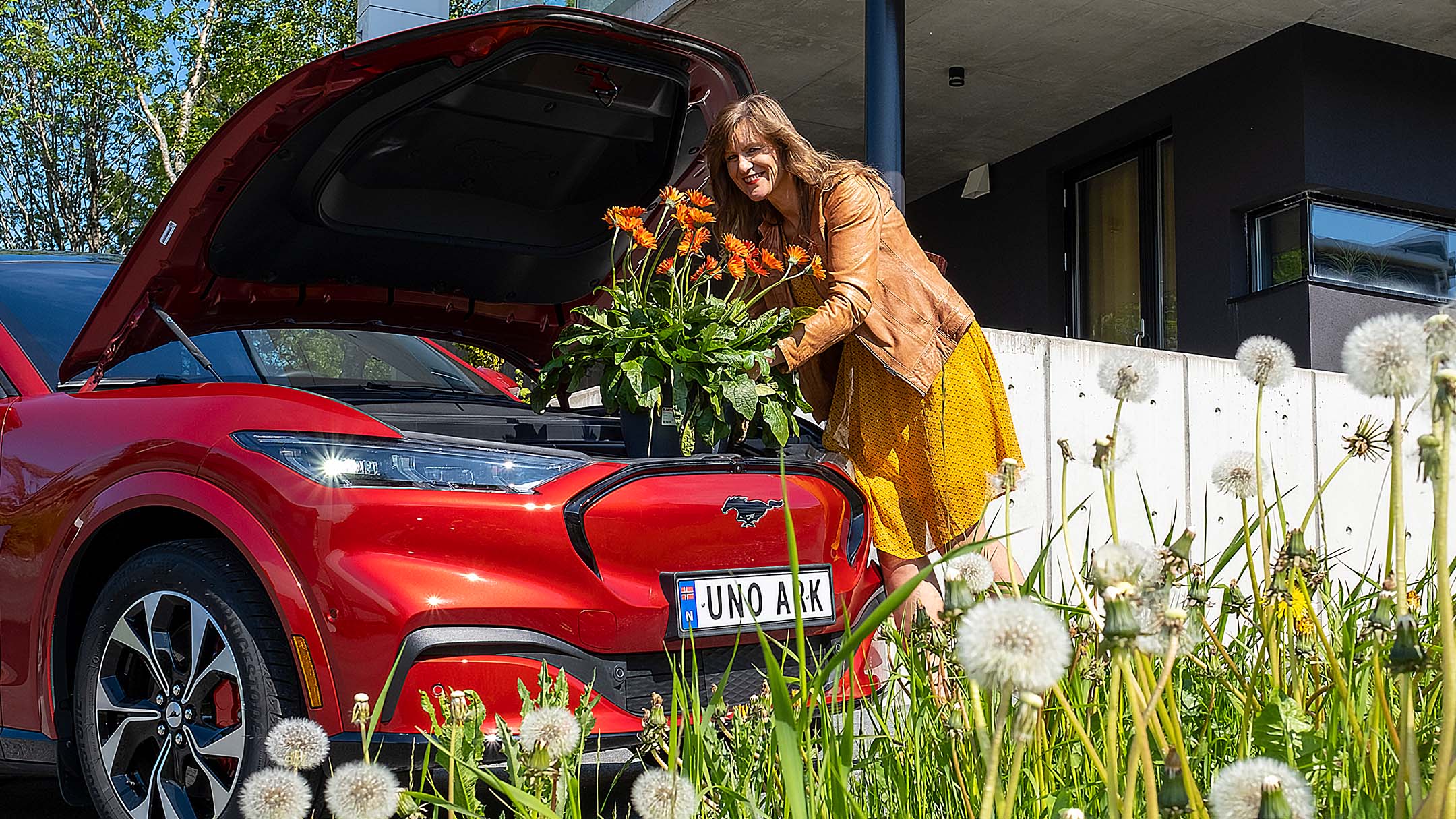 Lady in yellow dress and Mustang Mach-E