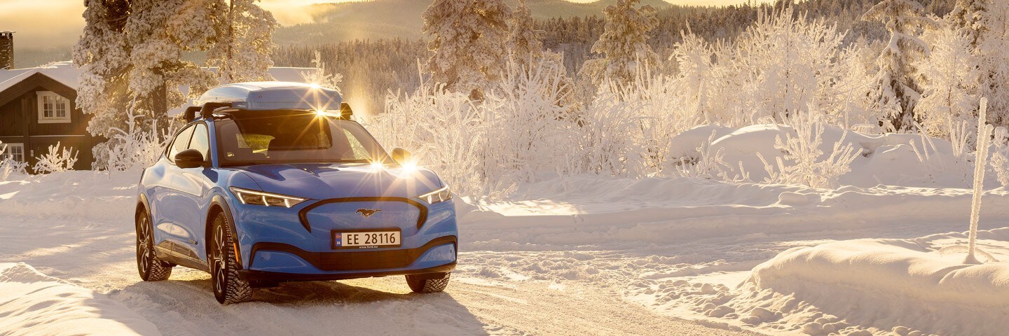 Blue Ford Mustang Mach-E in the snow