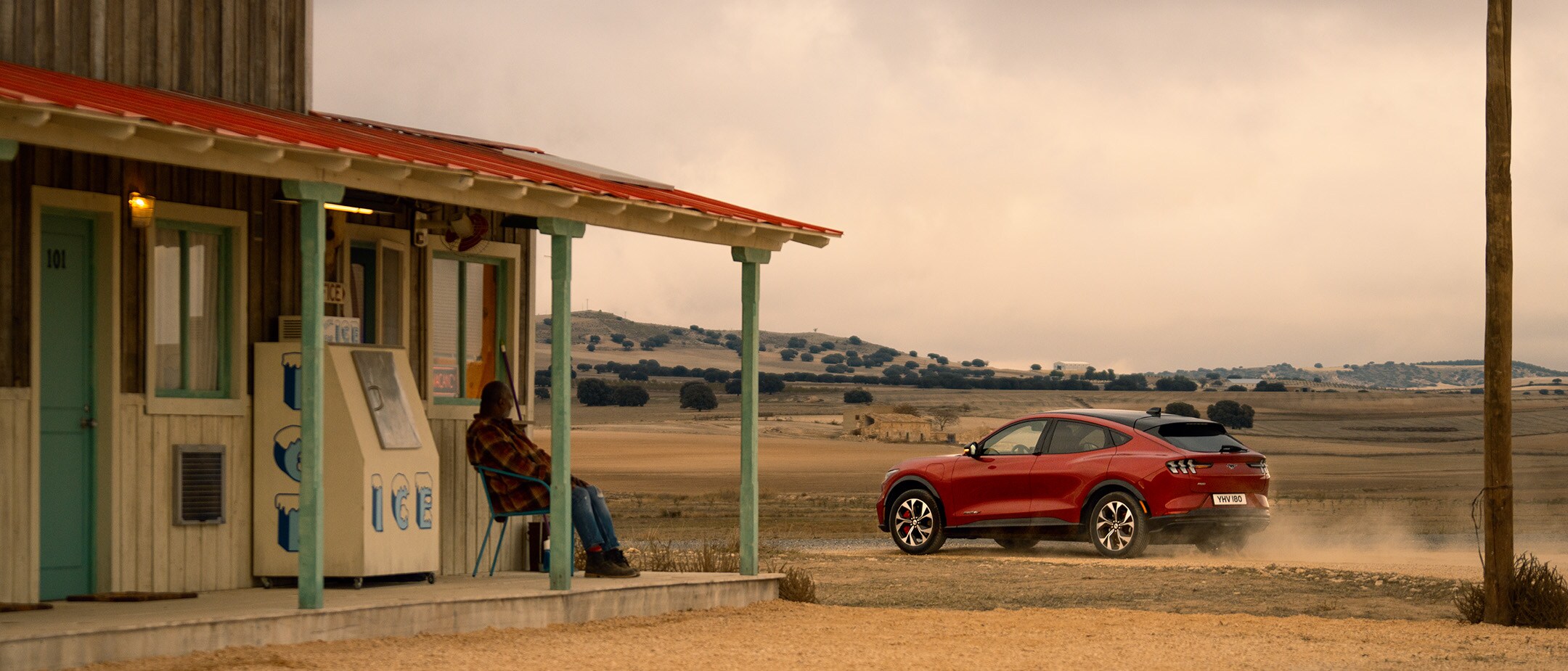 Red Ford Mustang Mach-E Premium AWD in the countryside