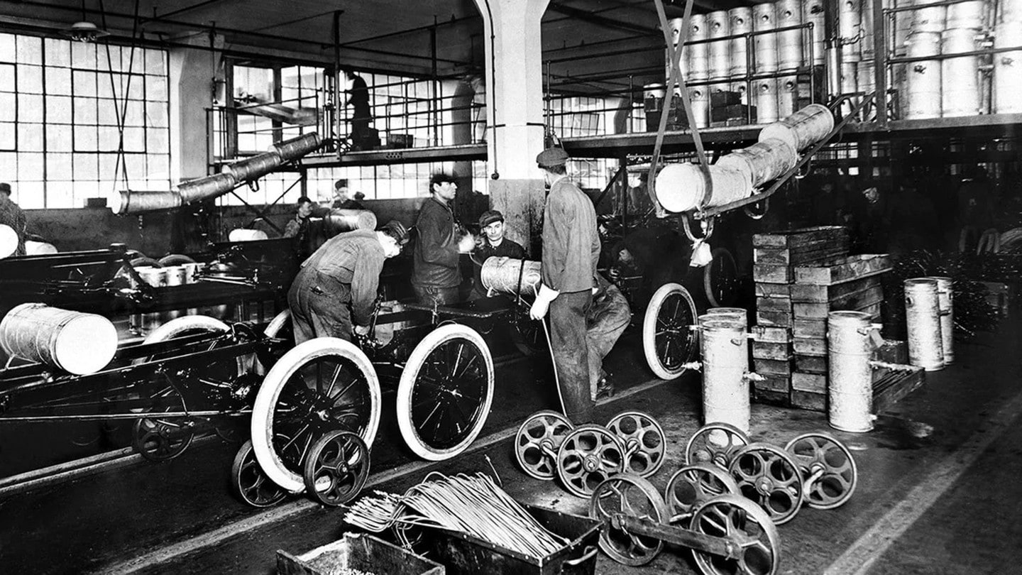 ford factory workers working on production line