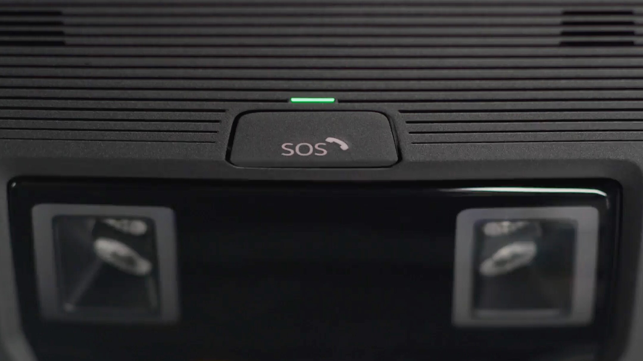 A close up of the SOS button of the eCall feature, positioned on the roof of the interior.