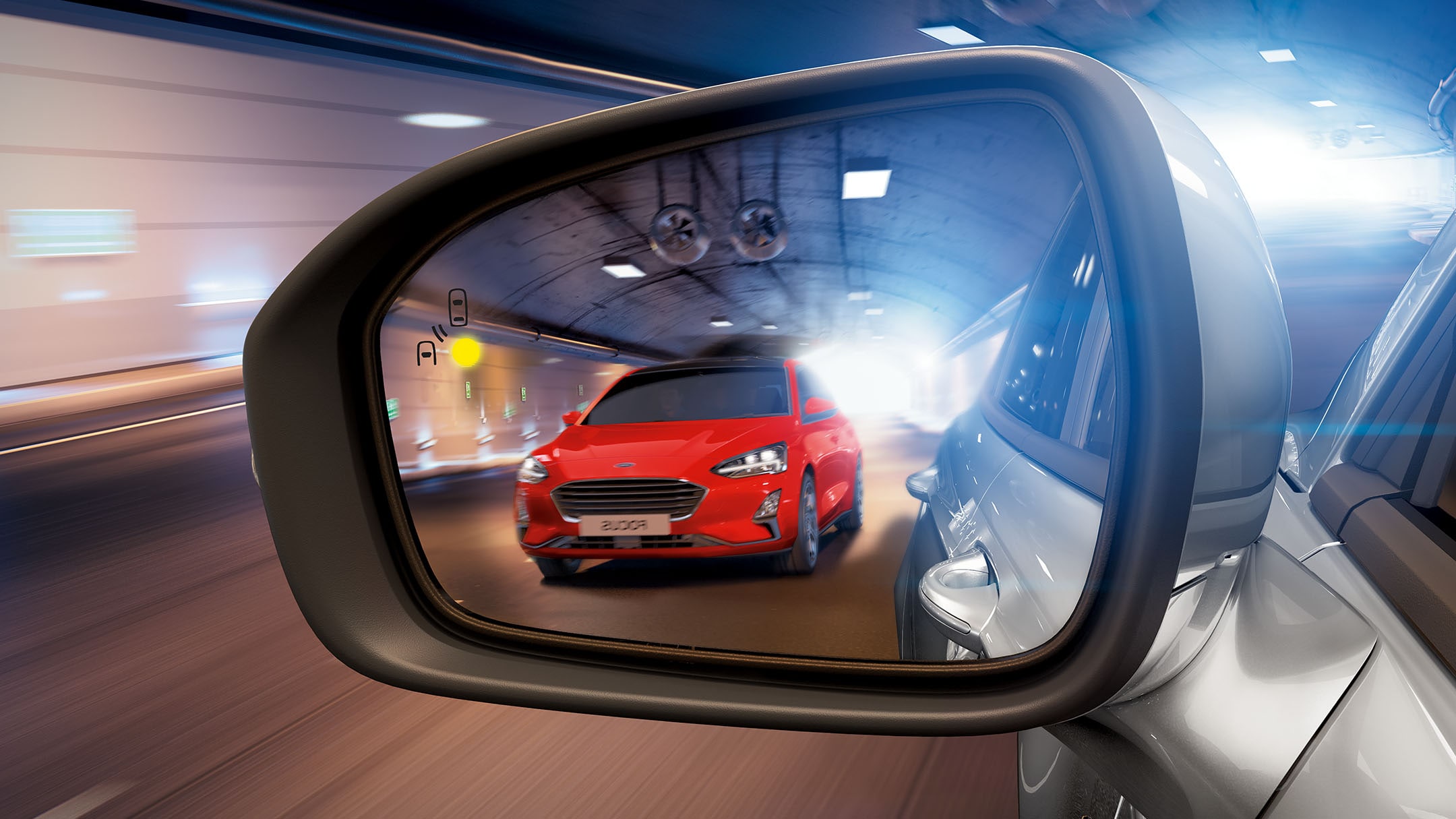 Red Ford Focus in the mirror