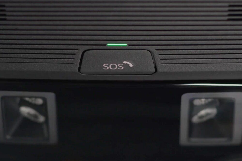 A close up of the SOS button of the eCall feature, positioned on the roof of the interior.