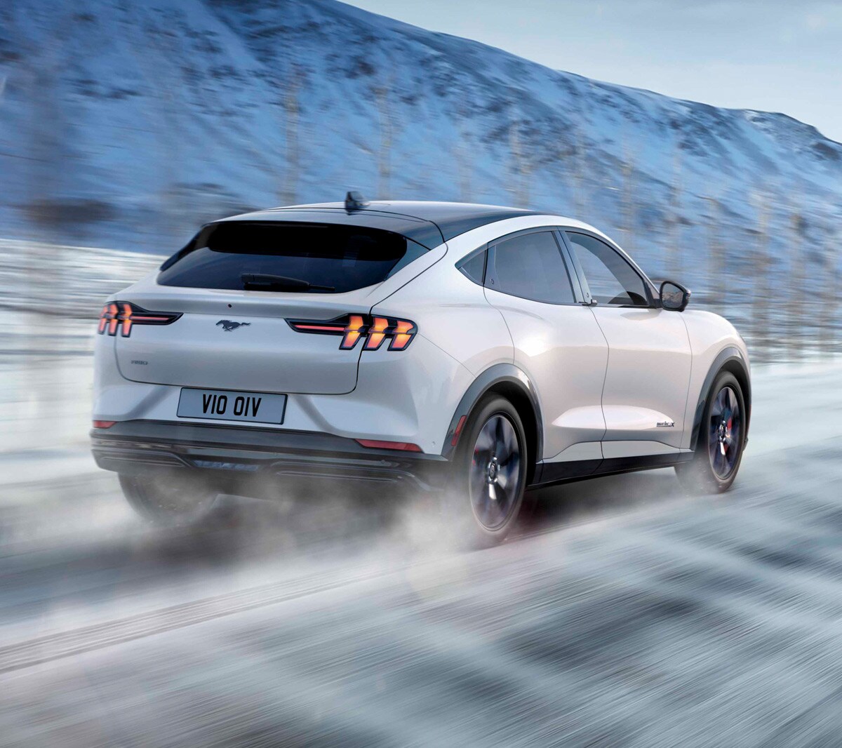 Ford Mustang Mach-E rear view driving in snow