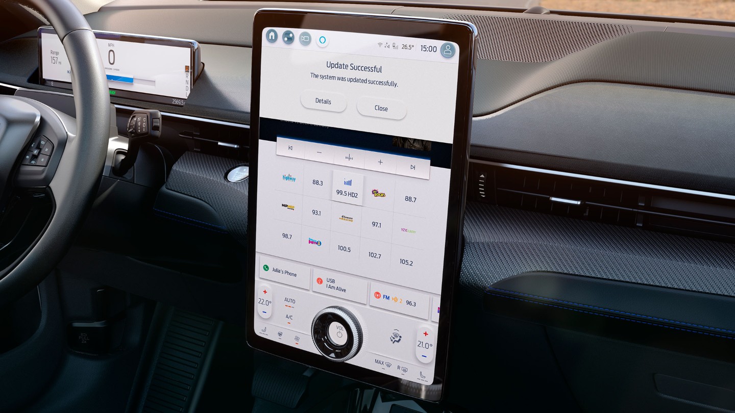 Driver using the SYNC 4 touchscreen in an All-New Ford Mustang Mach-E