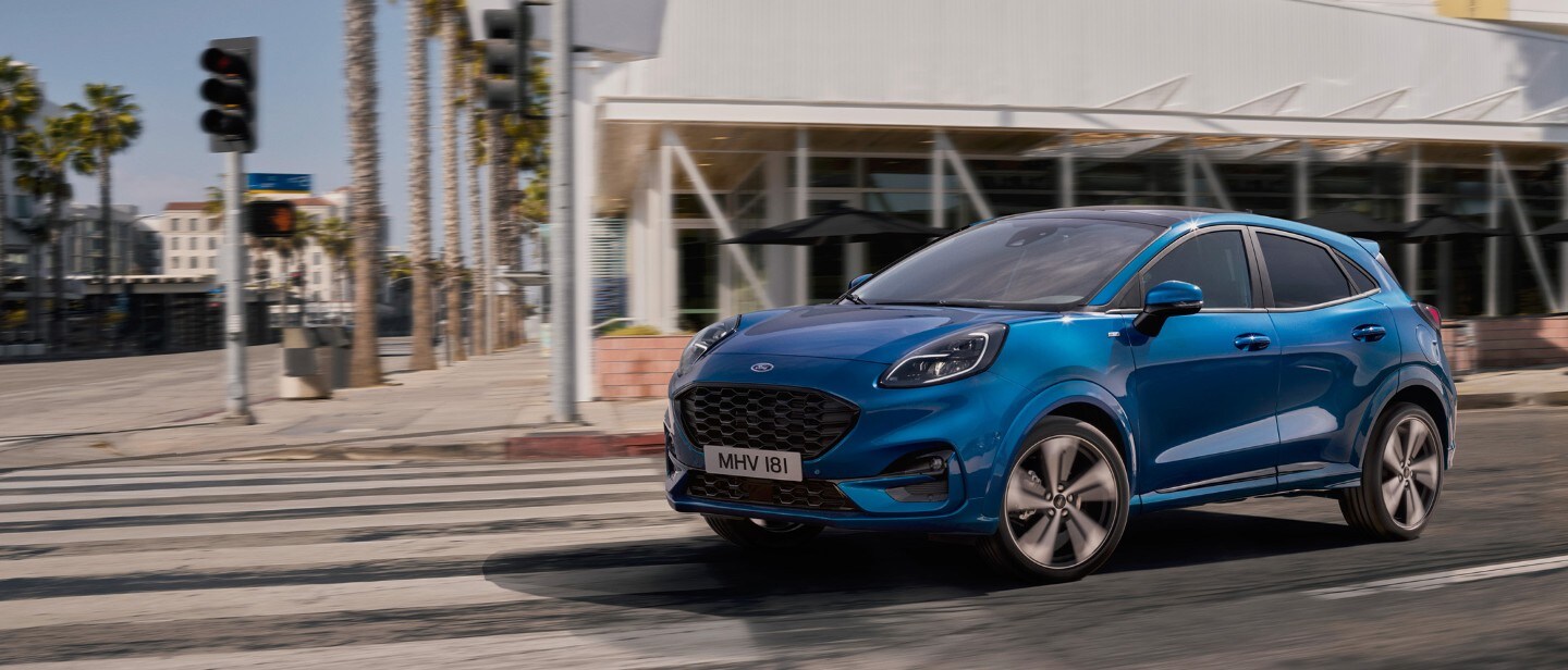 Blue Ford Puma driving Blue Ford Puma driving