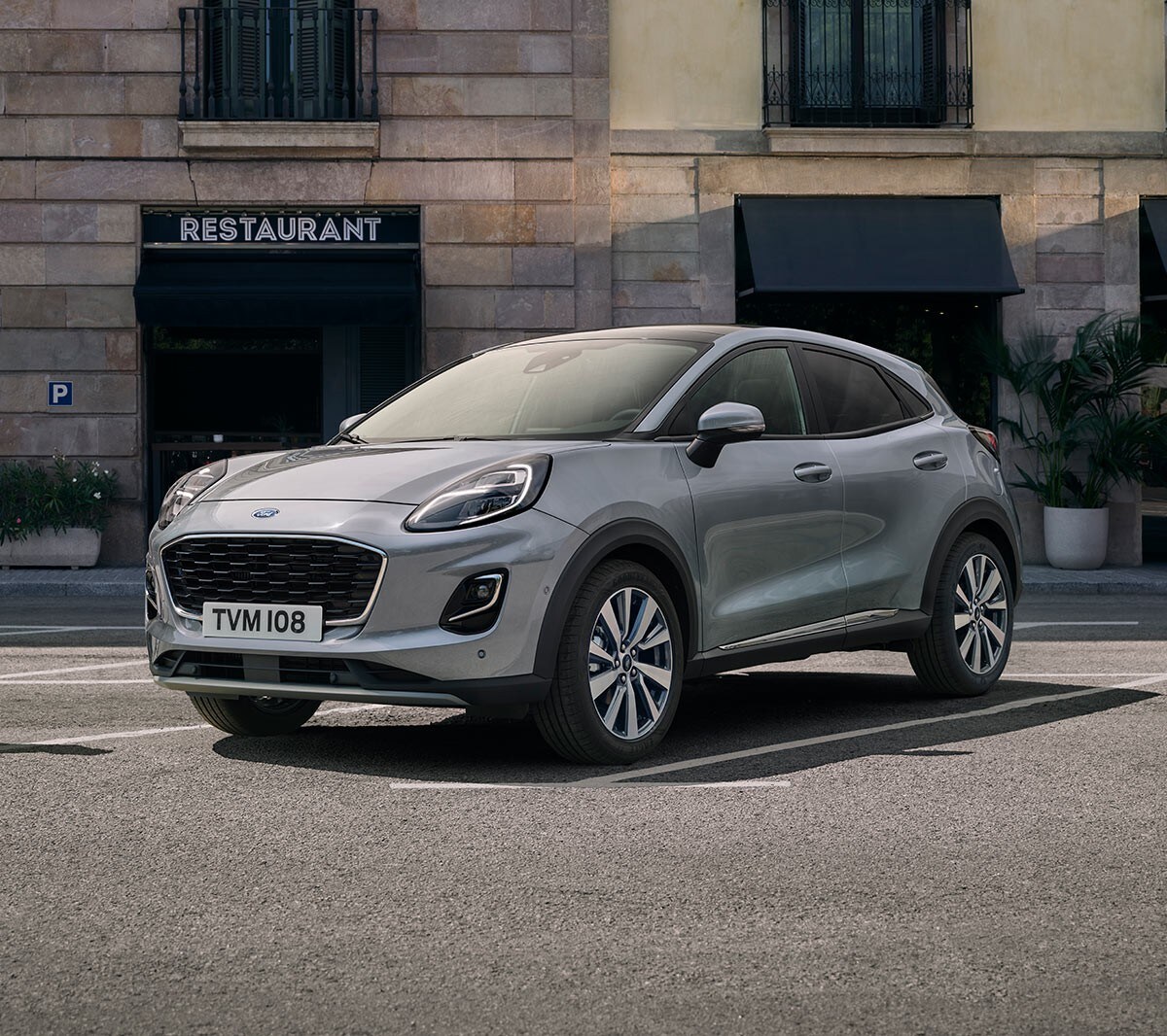 Blue Ford Puma driving in the city