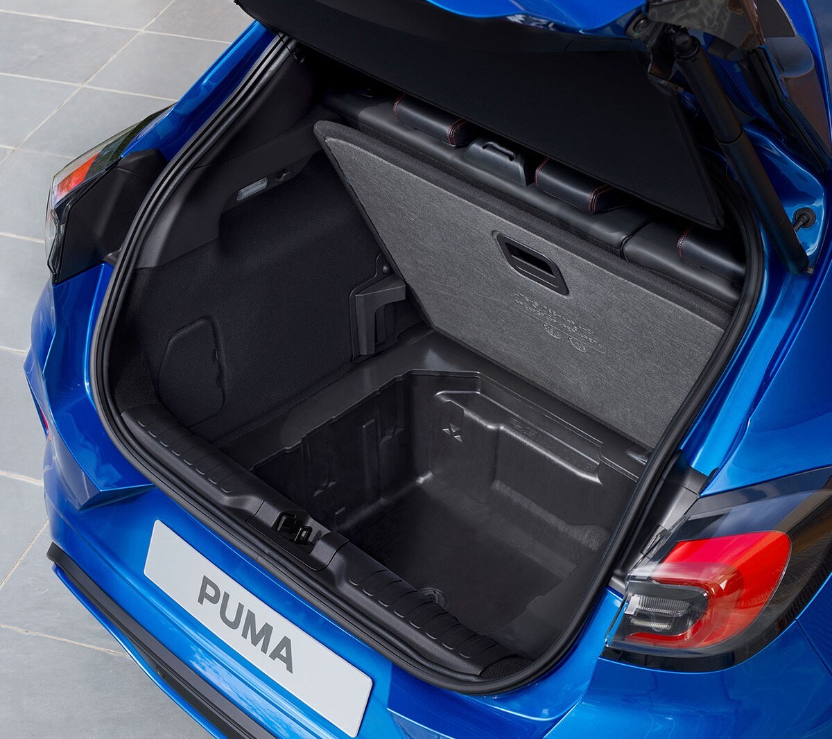 Blue Ford Puma rear view of open boot