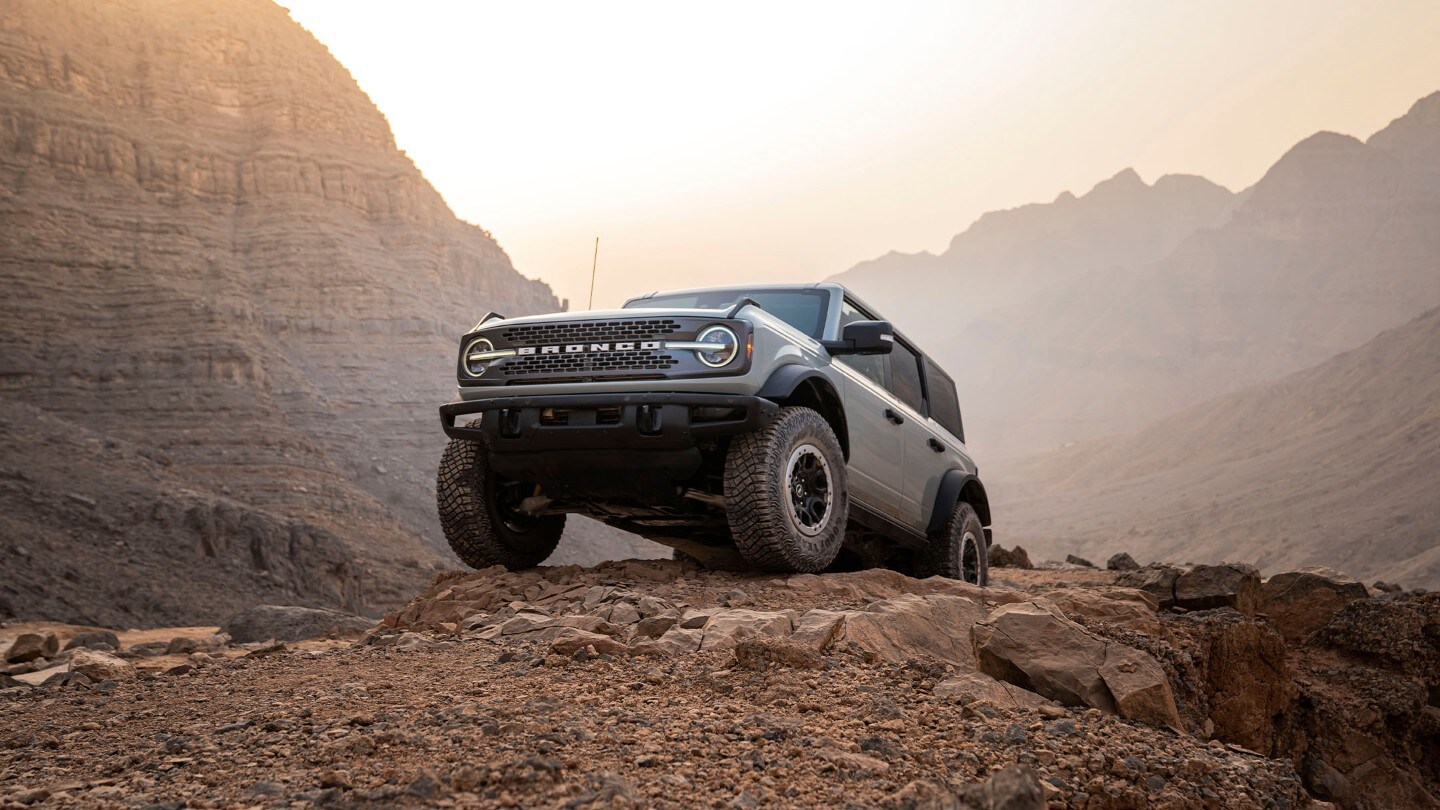 Ford Bronco front view parked on rocks in the desert mountains Ford Bronco front view parked on rocks in the desert mountains