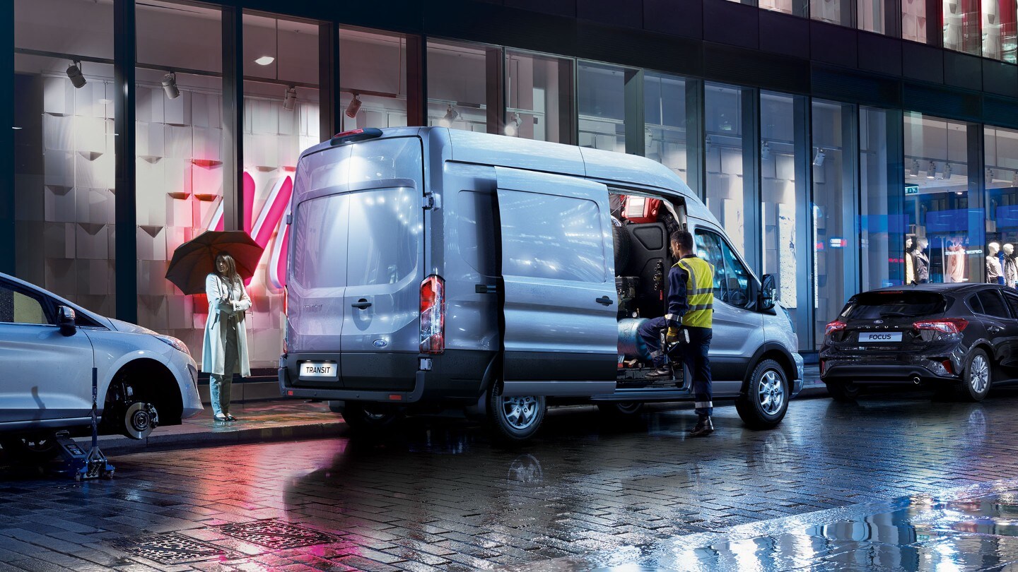 New Blue Transit Van loading at night on street