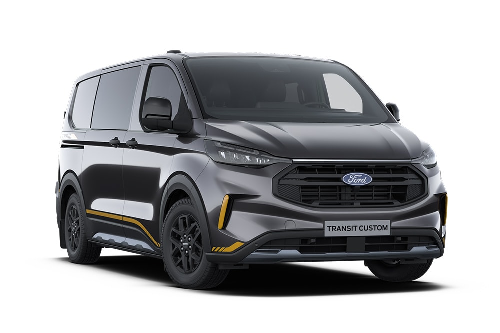 Mørkegrå Ford Transit Custom Trail dobbelkabin vare med gullfargede aksenter. Kun tilgjengelig som helelektrisk Limited i Norge.