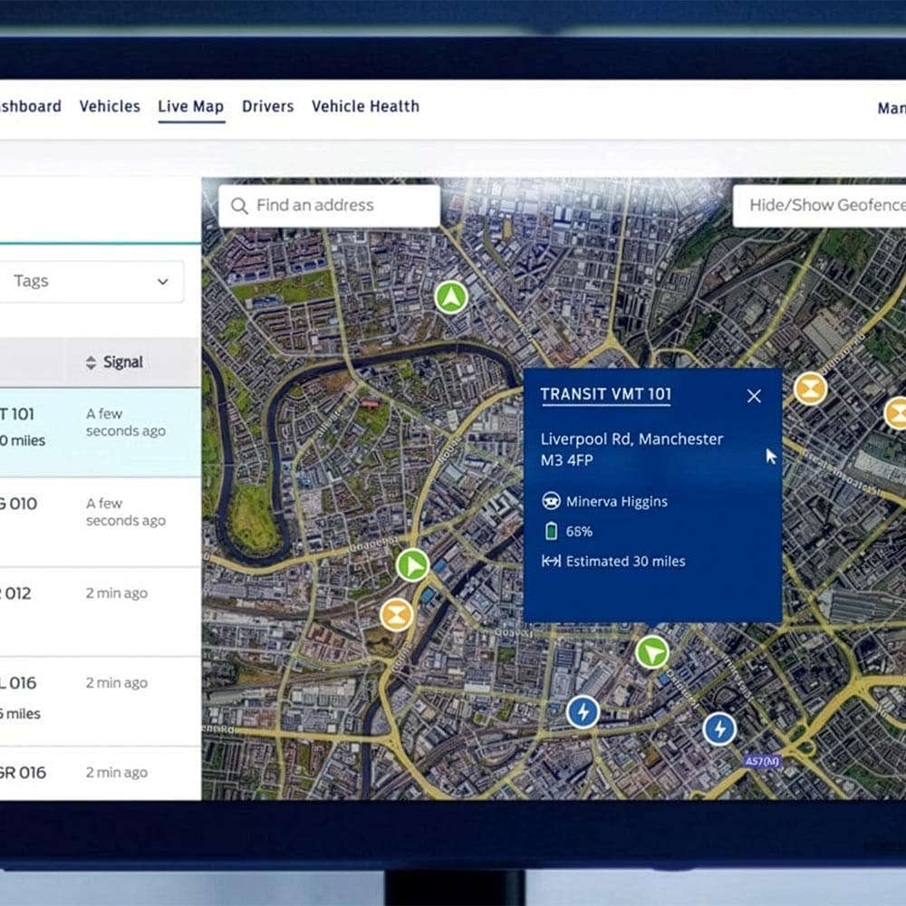 Touchscreen displaying Ford Pro Telematics software, showing a map with vehicle locations..