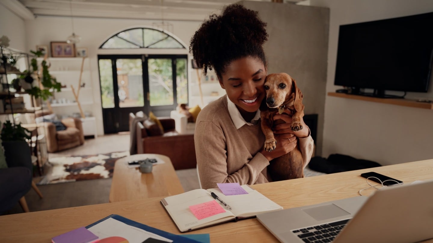 Woman with dog checking fleet finances