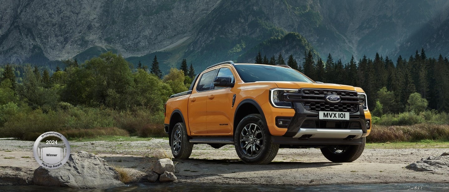 All-New Ford Wildtrak parked near mountains 3/4 front view